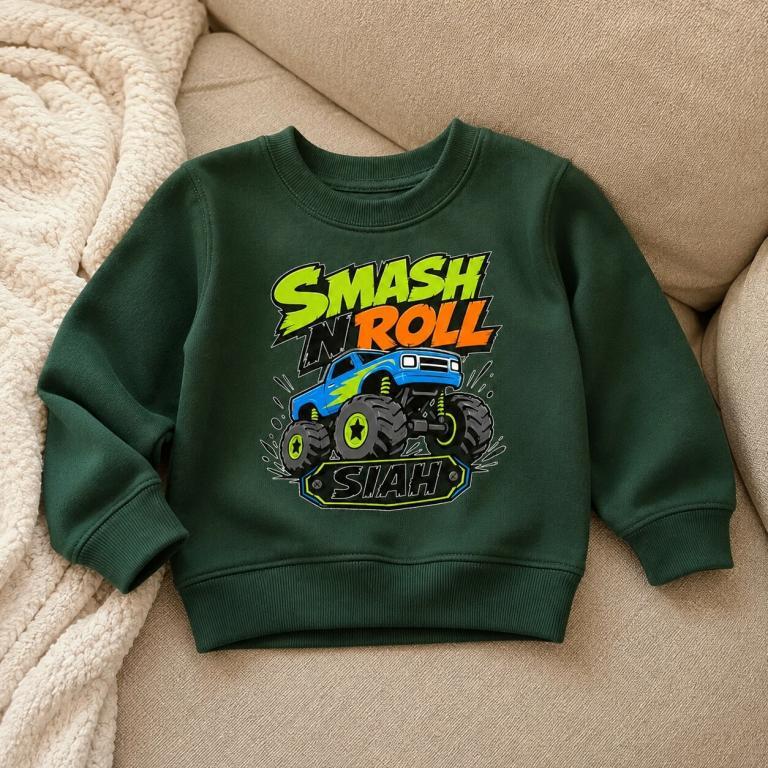 Green sweatshirt featuring a colorful monster truck design with "SMASH N ROLL" text
